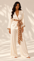 Dappled Grace cream silk pajama set by sleeps, with a wrap-style top, fawn-print belt and wide-leg trousers.